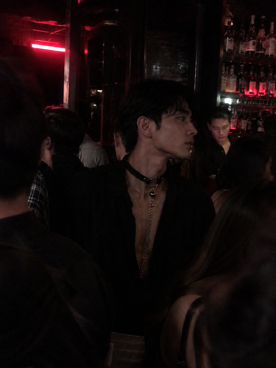 Man wearing WEIX red gothic choker with chain at a nightclub