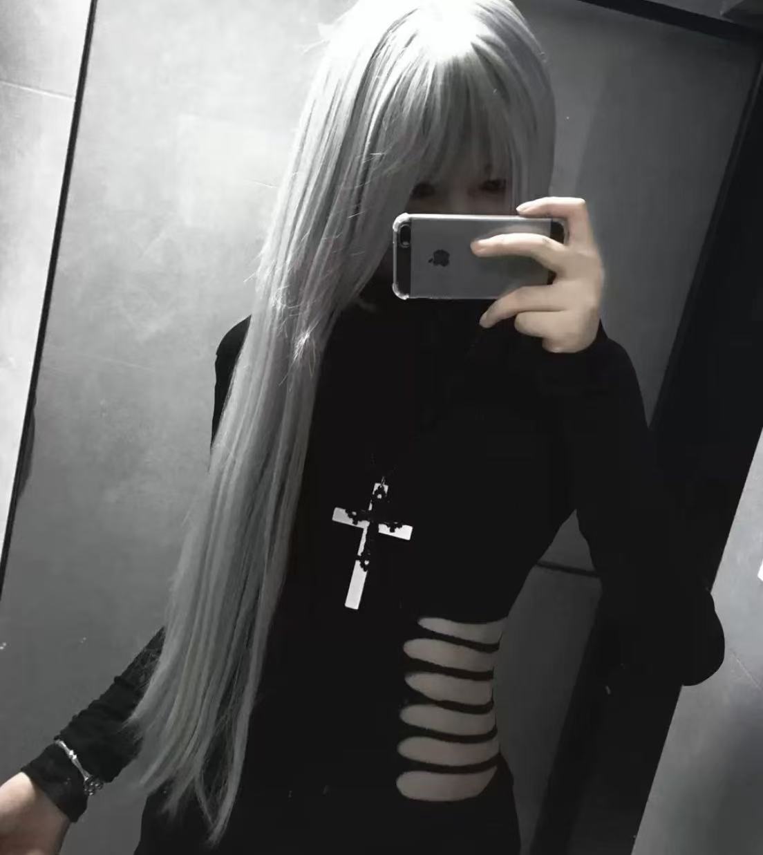Woman wearing WEIX black asymmetric cutout top showcasing a modern alternative style and fitted look
